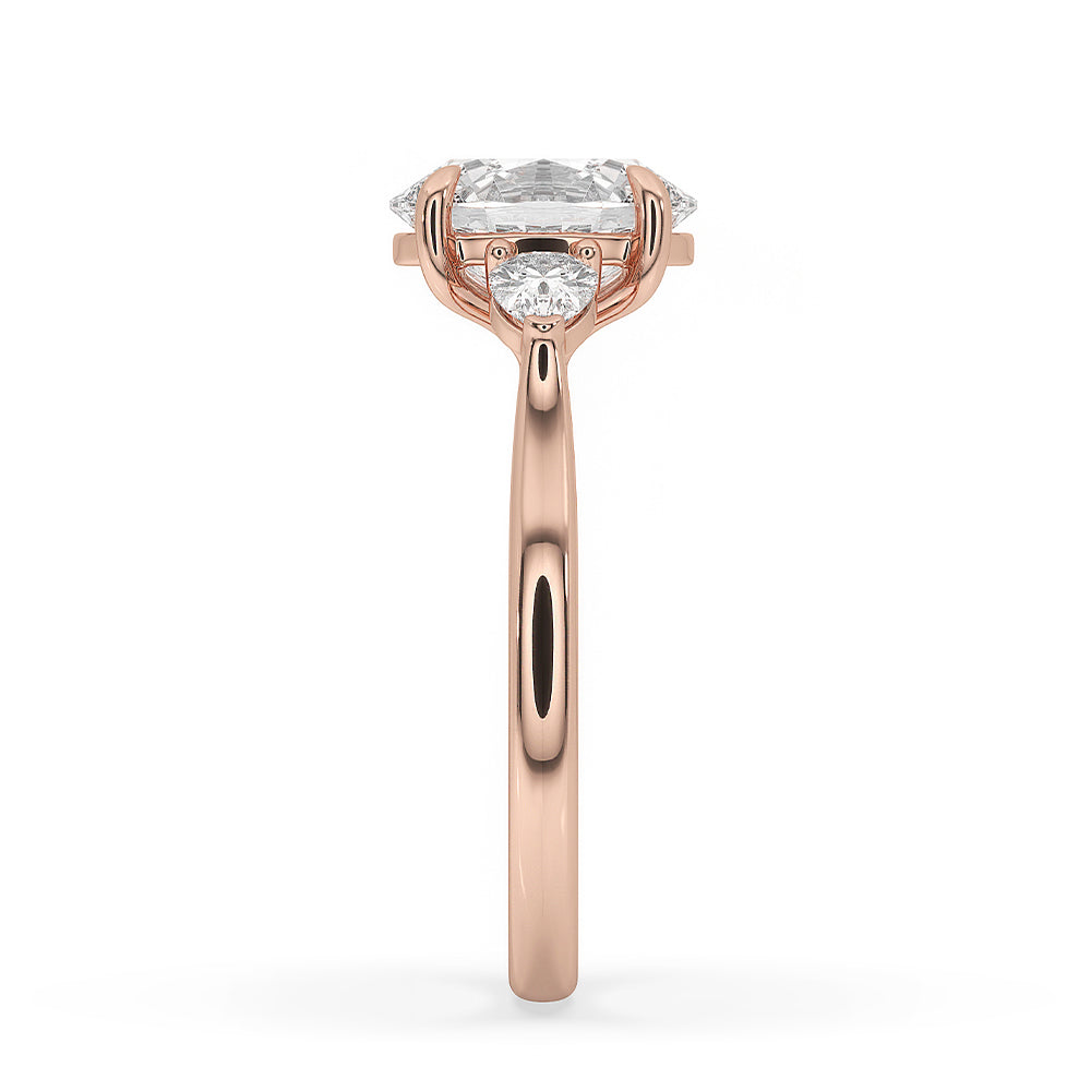 Claw prong ring featuring oval and pear-shaped diamonds.
