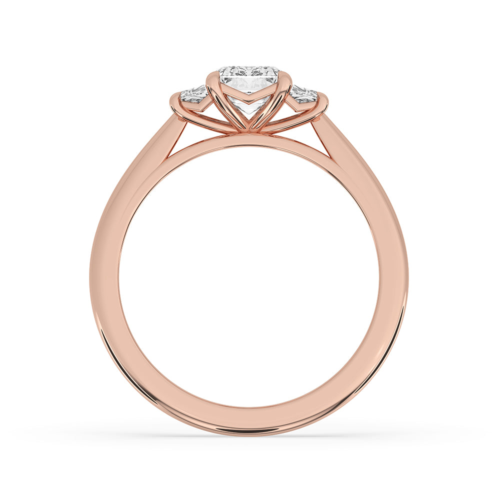 Claw prong ring setting showcasing a sparkling emerald cut diamond in rose gold.
