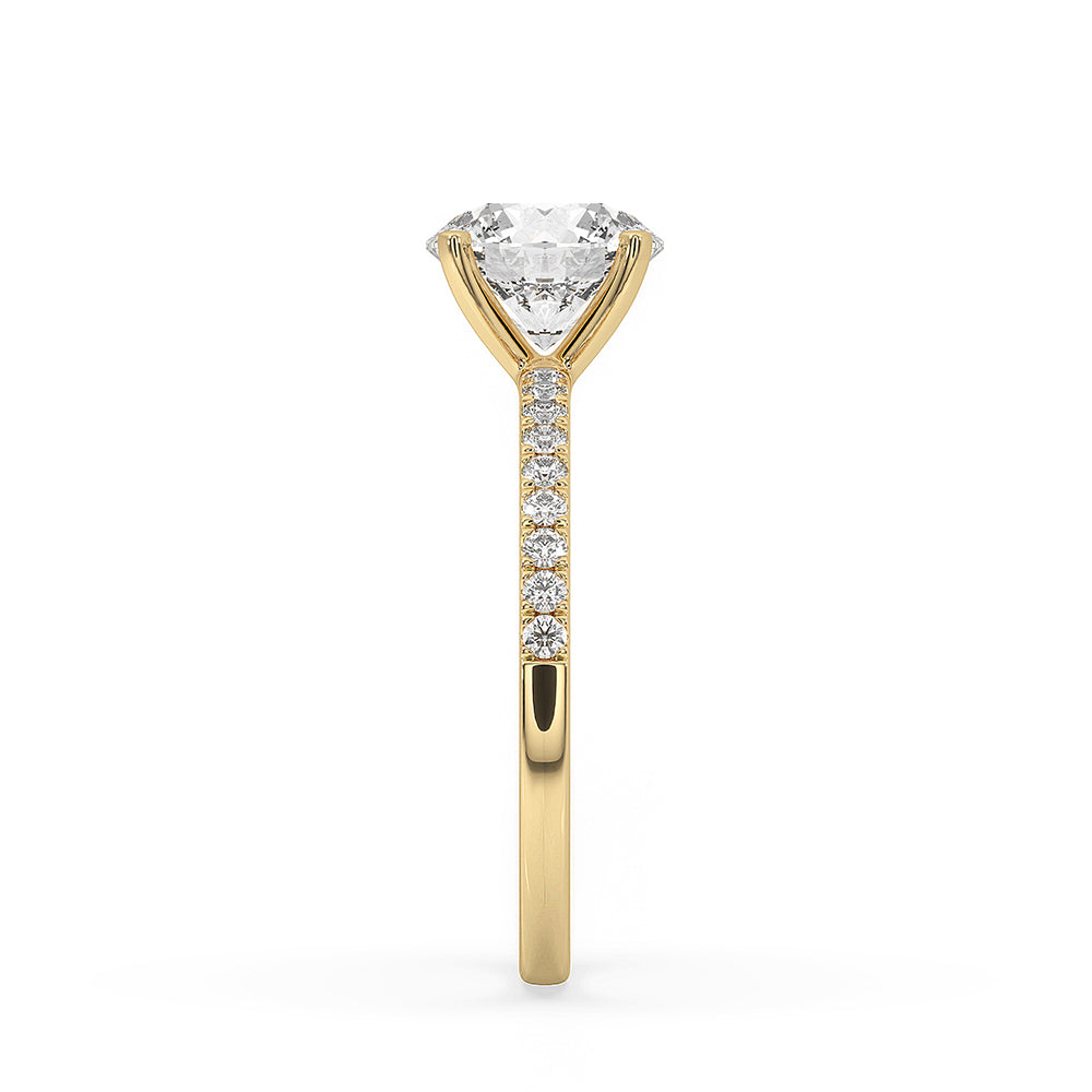 Yellow gold diamond ring with prong setting.
