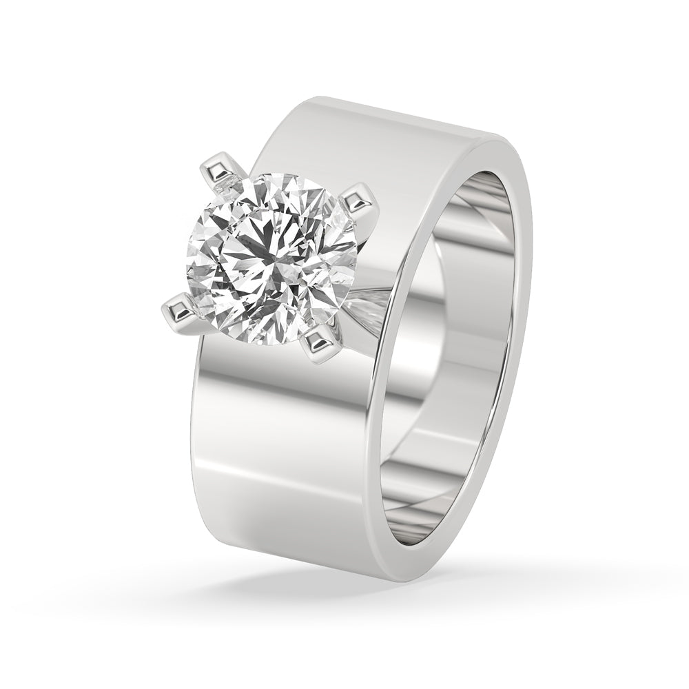 Wide band wedding ring featuring round brilliant cut diamond and 4 tab prong setting for added elegance.