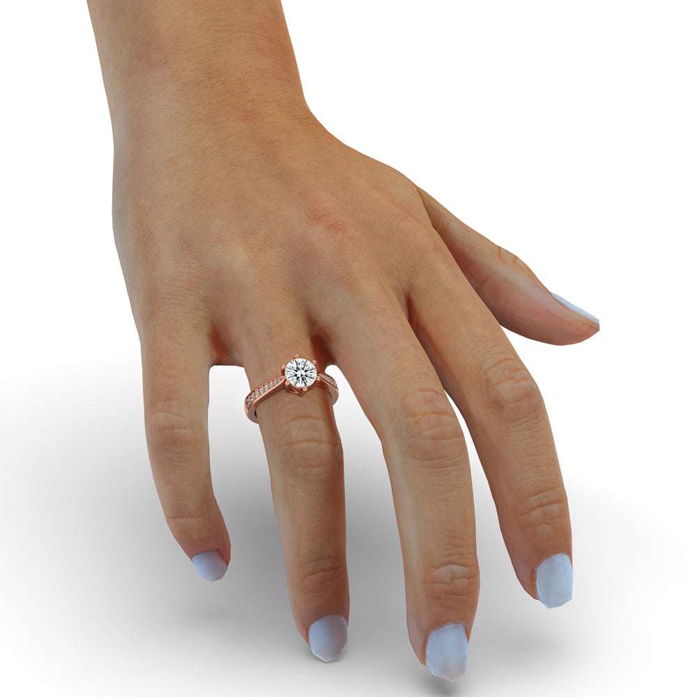 Round diamond engagement ring in six prong cathedral setting with a tapered ring design, perfect for carat diamonds engagement ring lovers.
