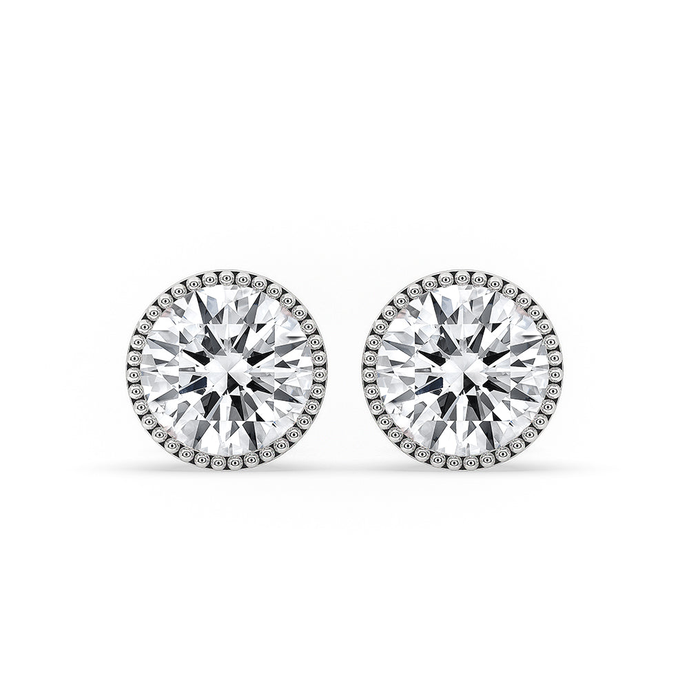 White gold stud earrings featuring a clean and minimal design.
