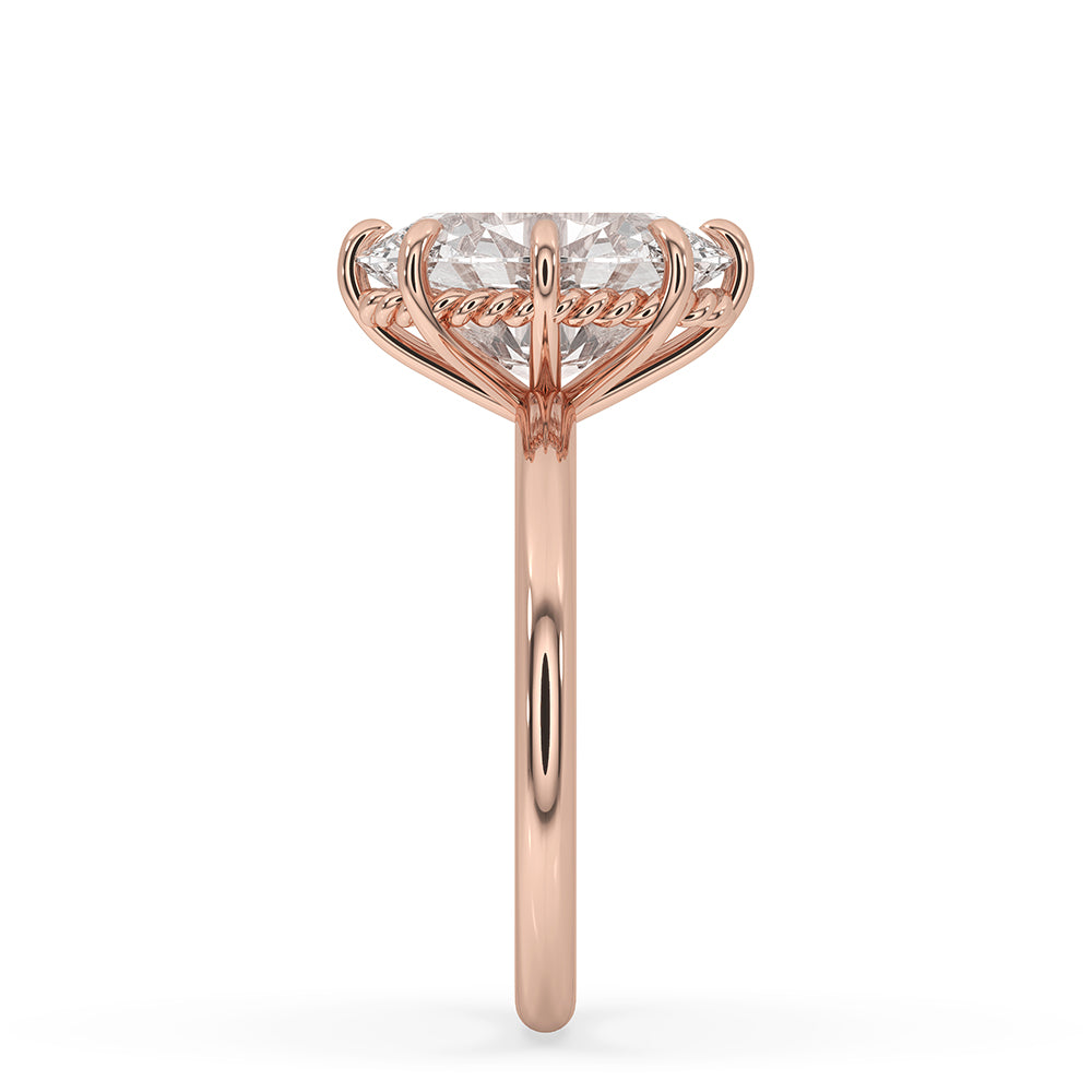 Prong basket design securing an oval cut diamond.
