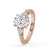 Elegant rose gold 3 stone engagement ring with oval and pear diamonds.
