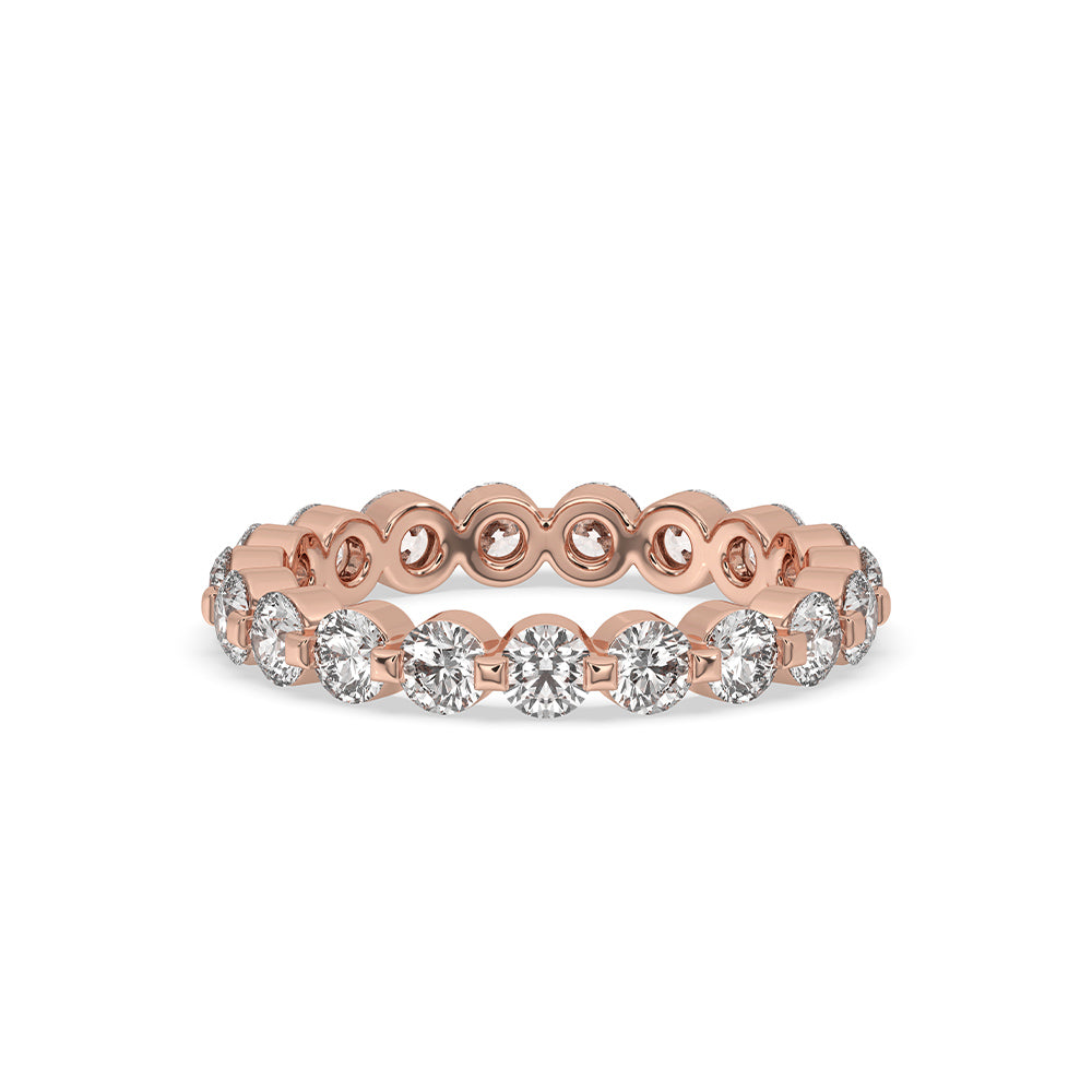 Round diamond eternity band in rose gold with sparkling diamonds.
