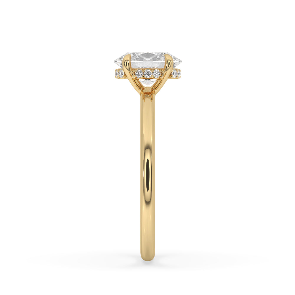 Yellow gold diamond ring catching the light on a hand.