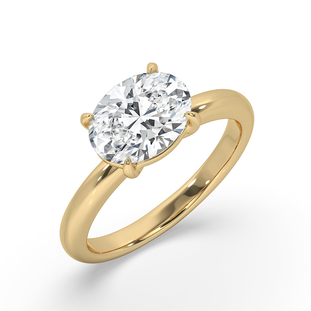 Oval brilliant cut diamond set in yellow gold diamond ring.