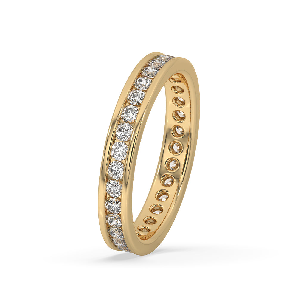 Yellow gold eternity band featuring a channel set diamond band for elegance.
