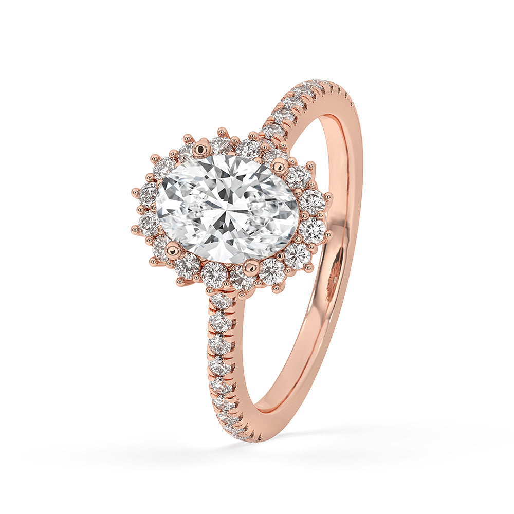 Pave setting ring with a brilliant oval cut diamond, offering a sparkling look.
