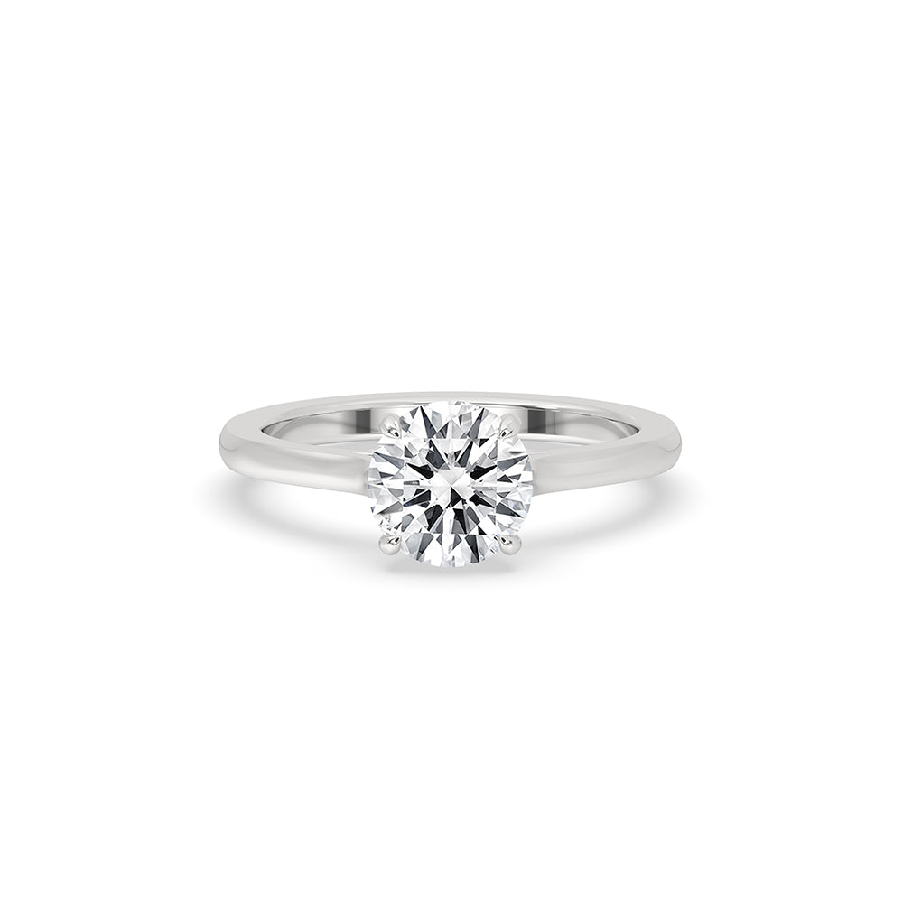 Cathedral setting ring with a round cut diamond, crafted in white gold.
