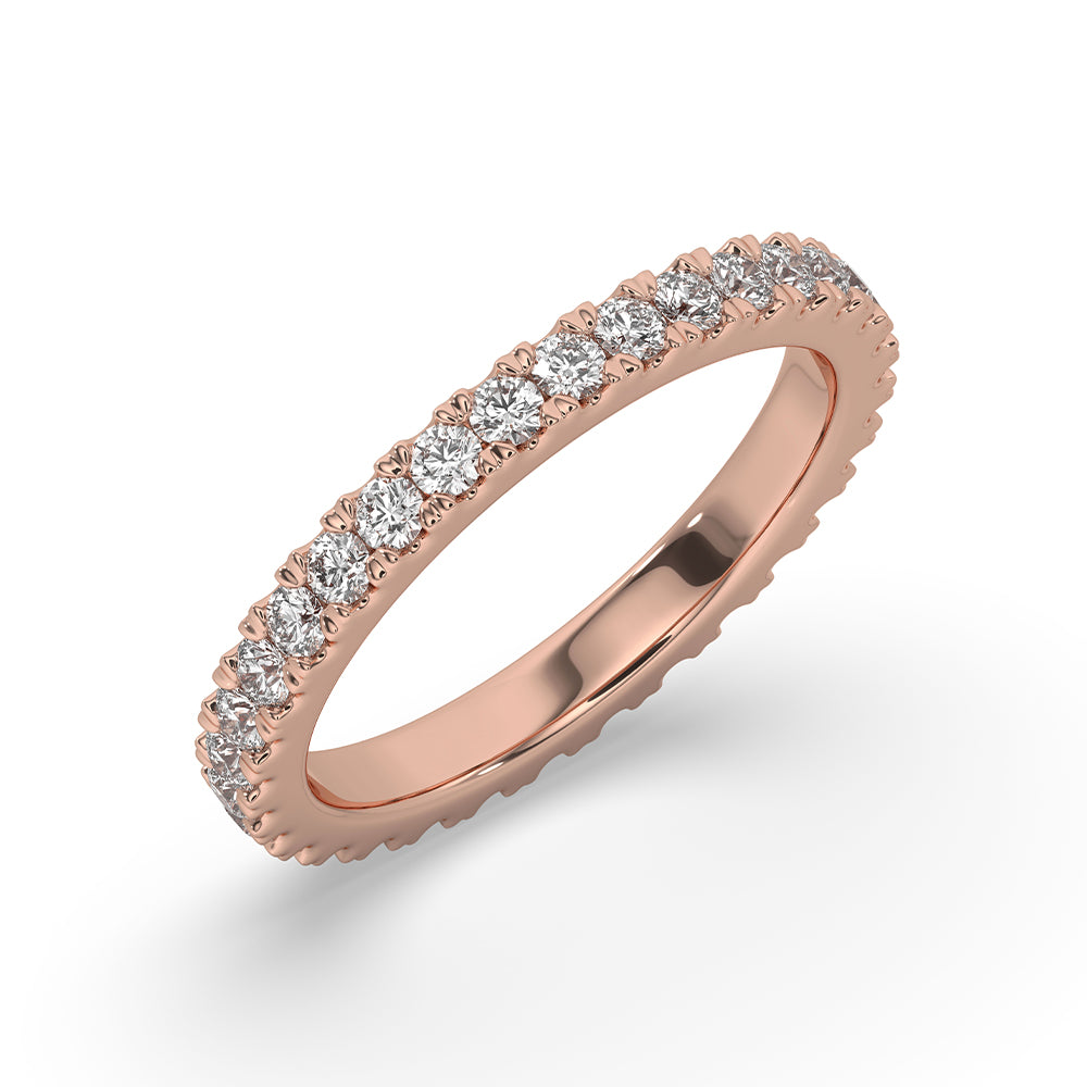 Handmade jewelry piece featuring a rose gold diamond eternity band.
