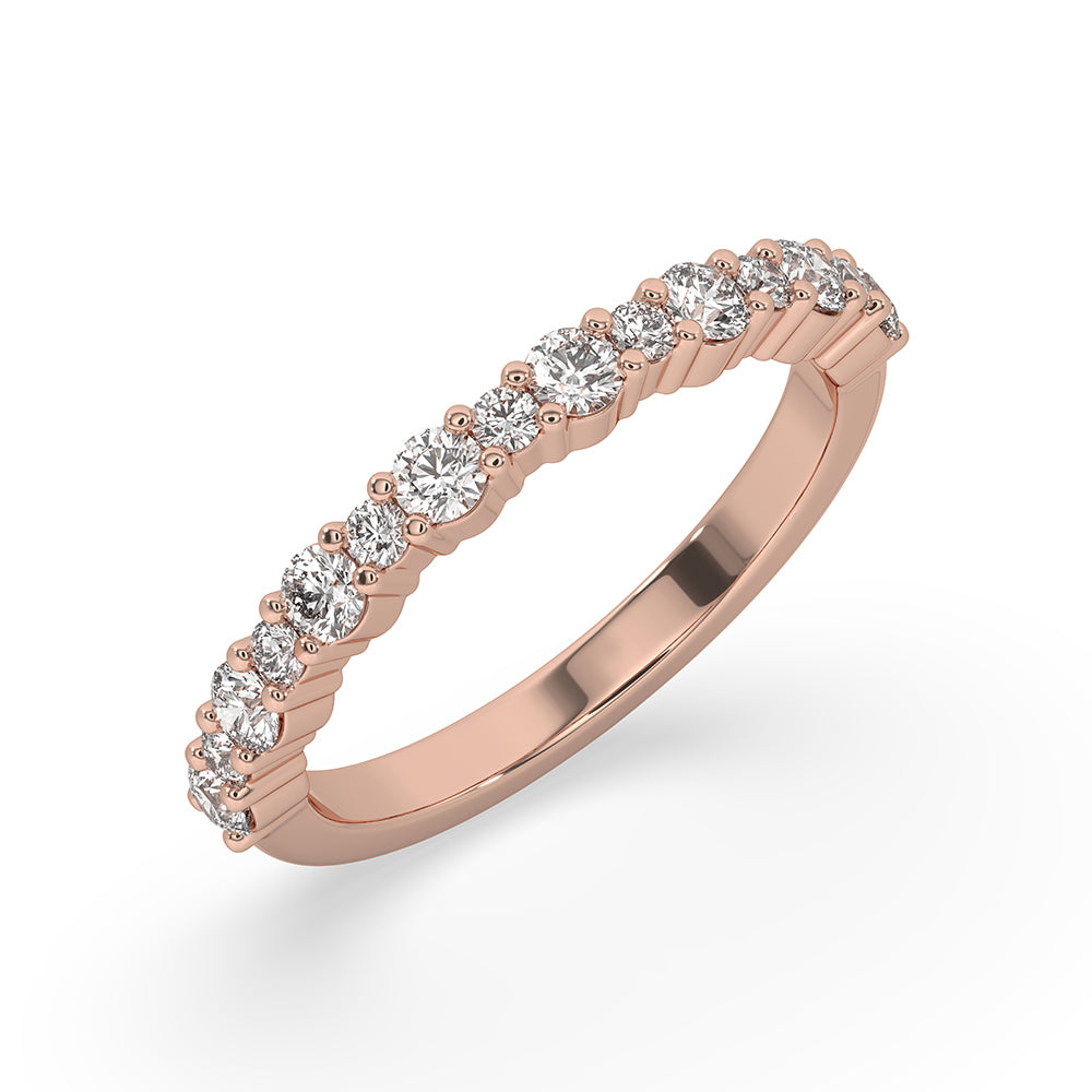 Lab grown round diamonds set in a handmade prong set wedding band.
