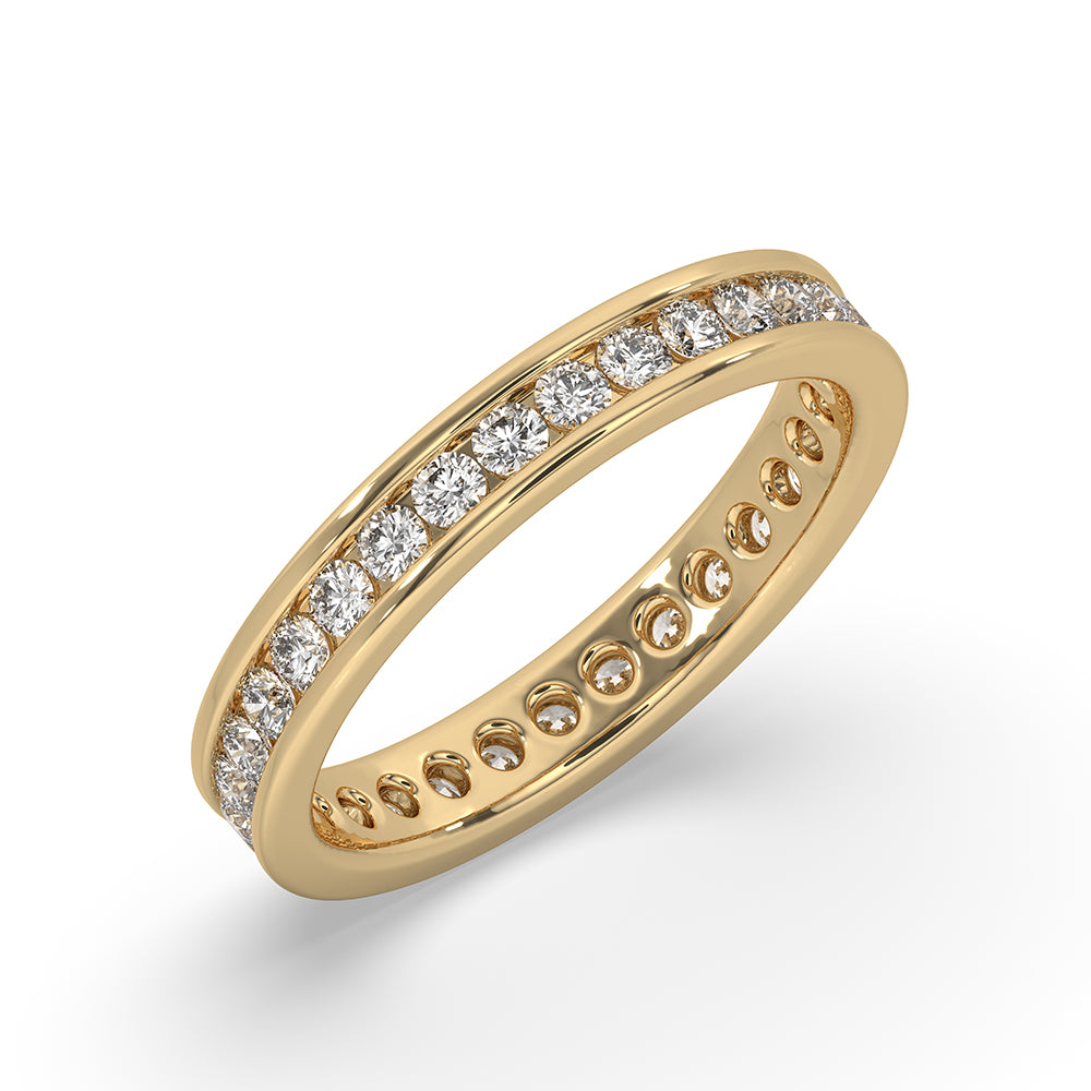 Yellow gold diamond band with a channel set wedding band for timeless beauty.
