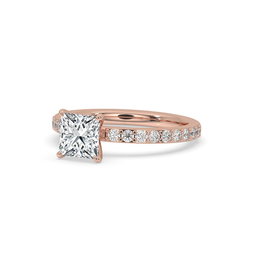 Rose gold ring with round cut pave set diamonds, perfect for an engagement.
