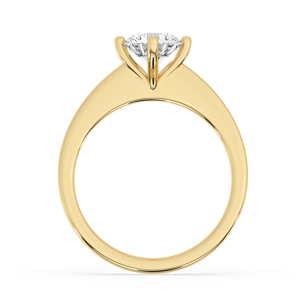 Yellow gold solitaire diamond ring with a sleek tapered shank, perfect for any engagement.
