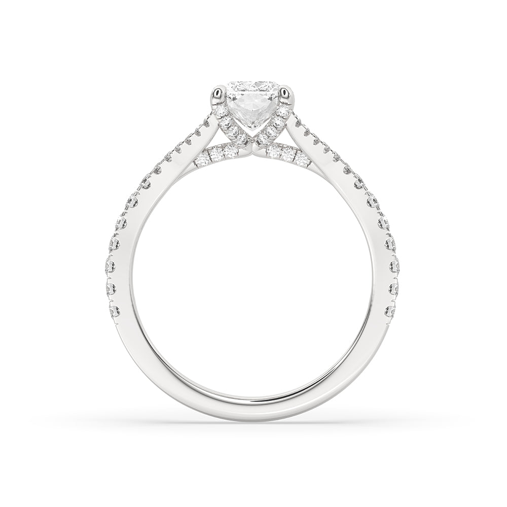 Four claw prong ring showcasing a brilliant cushion cut diamond in white gold.
