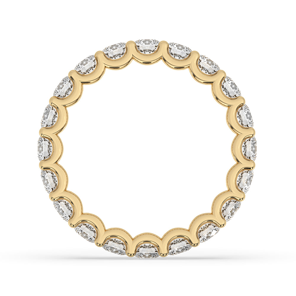Prong set band holds each round cut diamond securely in yellow gold.
