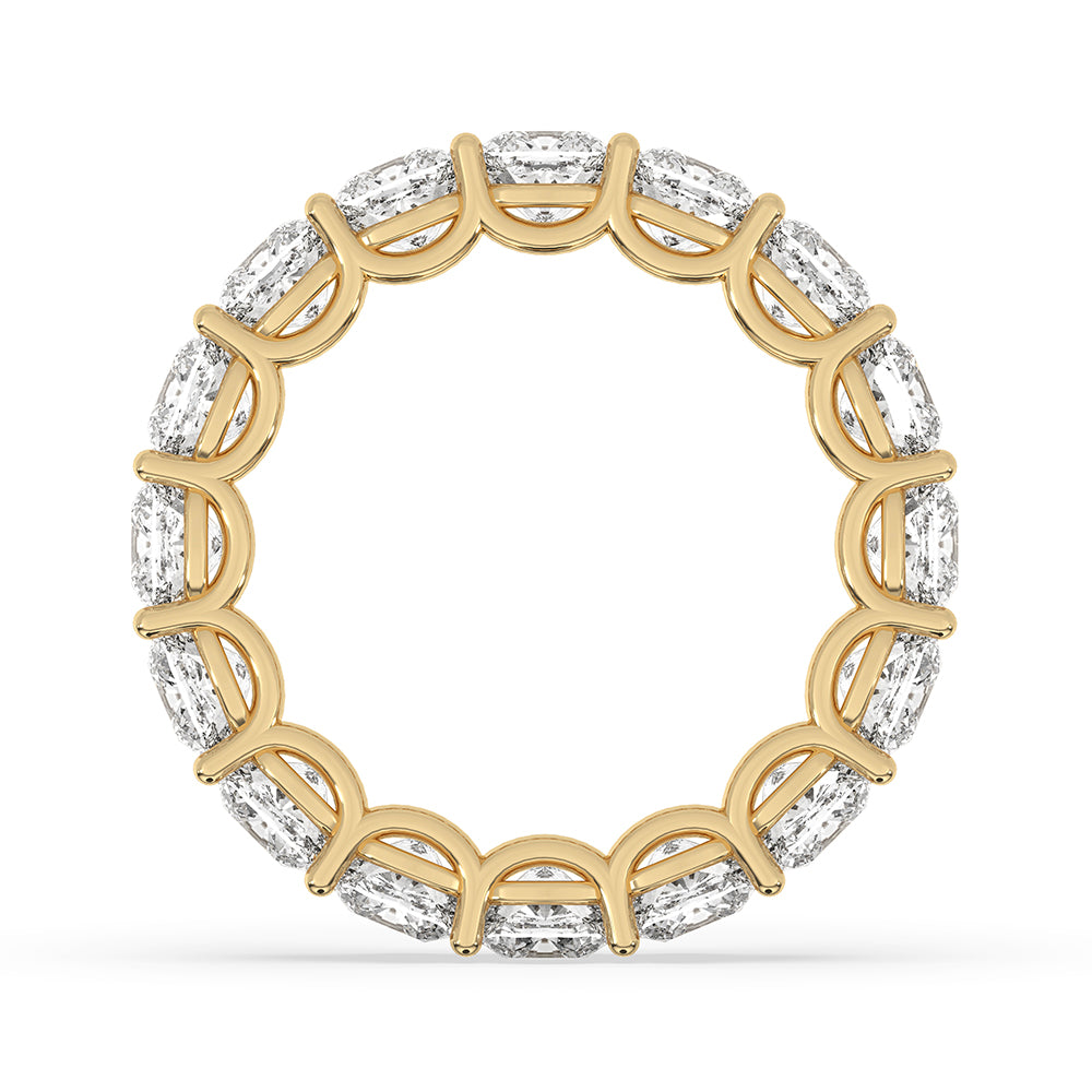 Custom wedding band with cushion cut diamonds in yellow gold.
