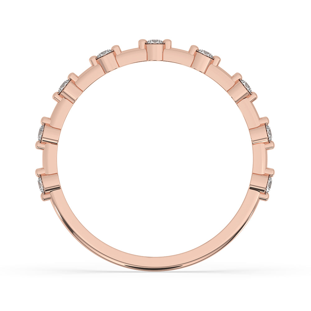 Round cut diamond band styled as a simple wedding band in rose gold.
