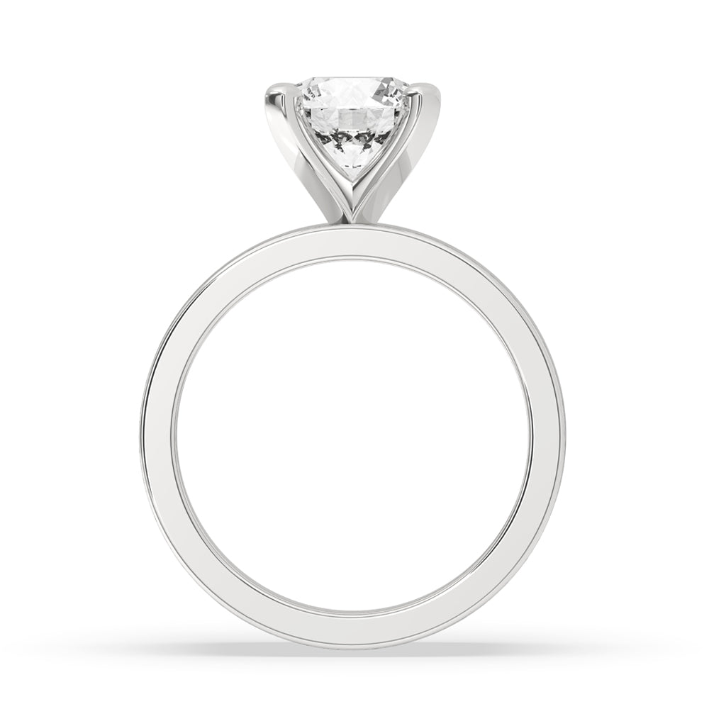 Round diamond wide band ring in a solitaire ring setting with a one diamond ring focus.
