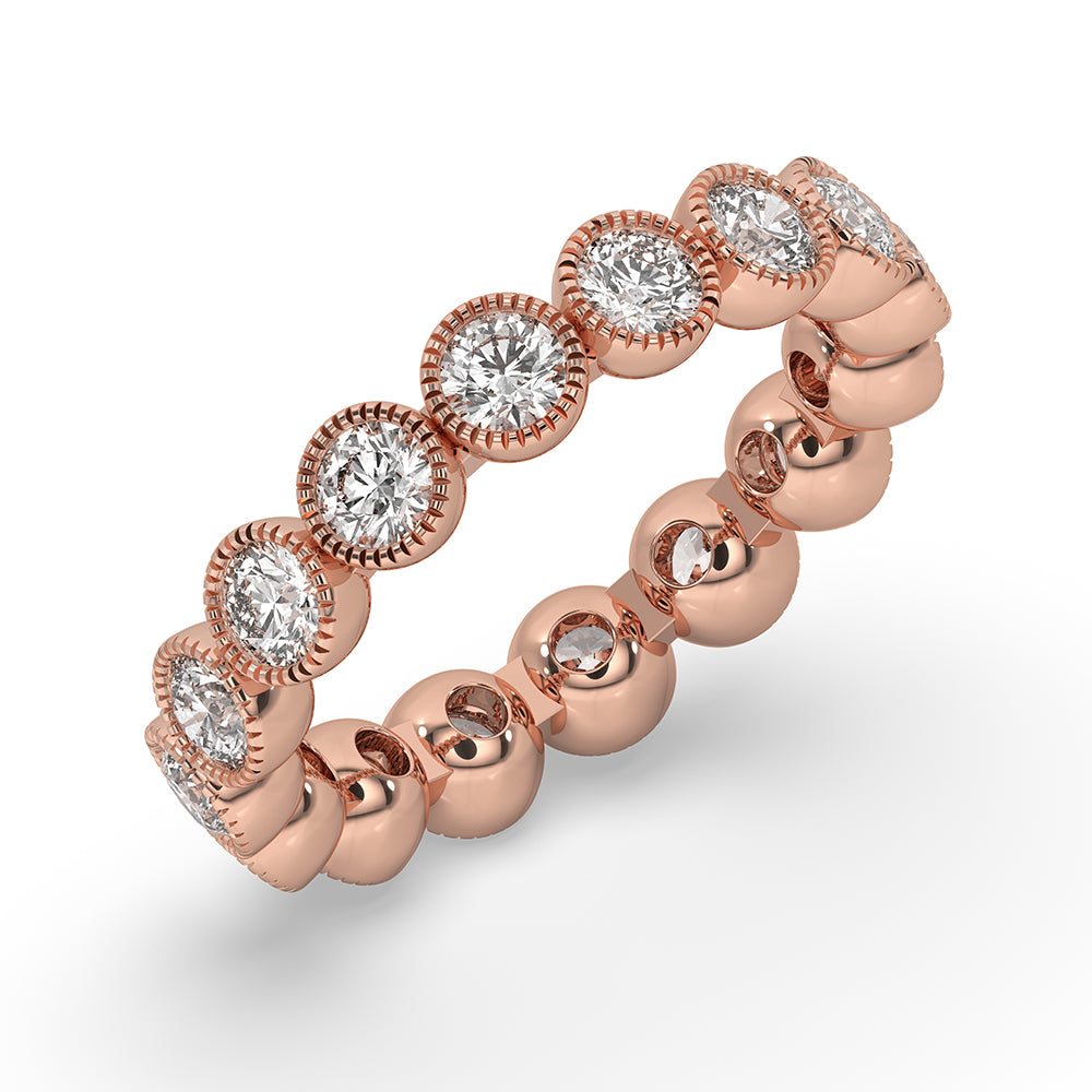 Rose gold wedding band with a bezel set design and round diamonds.
