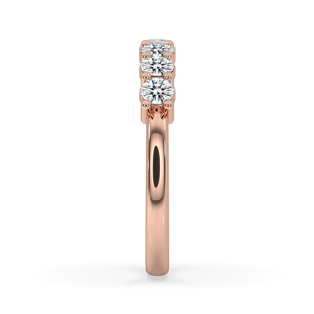 Half eternity band paired with Lab Grown Diamond in custom wedding band design.
