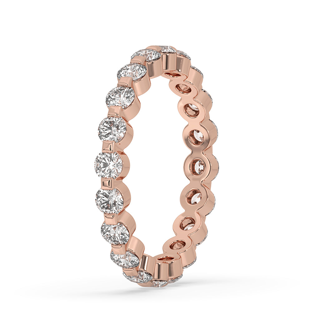 Custom wedding band in rose gold designed with carat diamonds.
