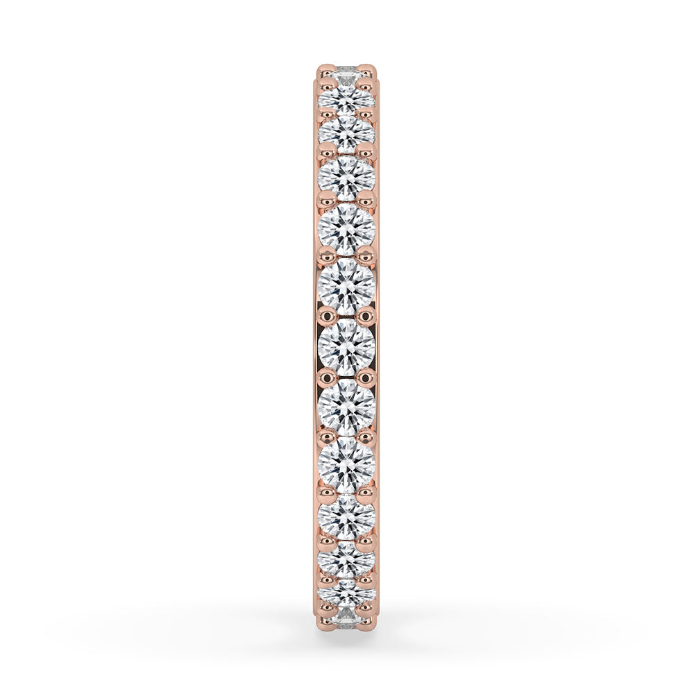 Rose gold band with handmade jewelry details and round cut diamonds.
