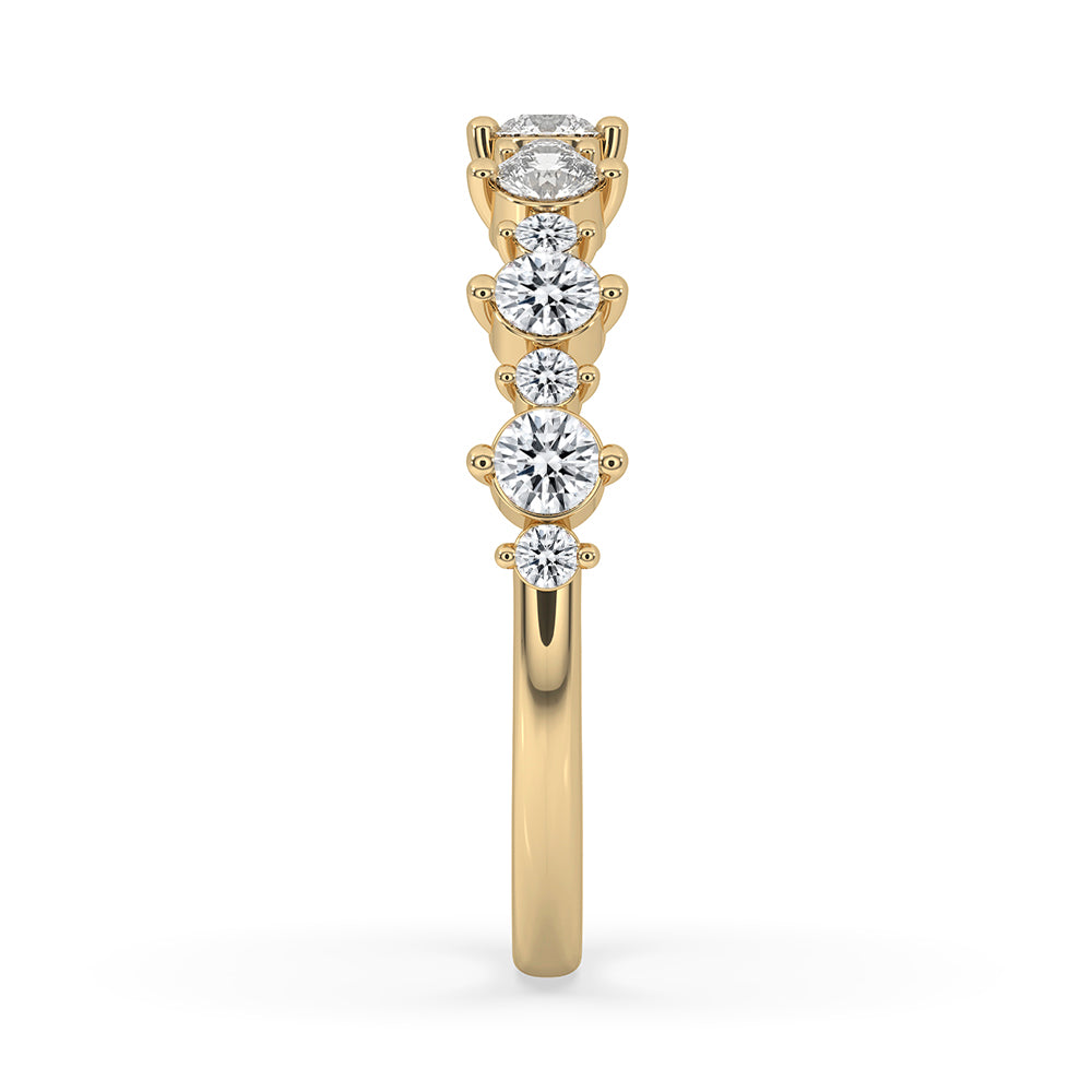 Prong set band features secure round cut lab grown diamonds.
