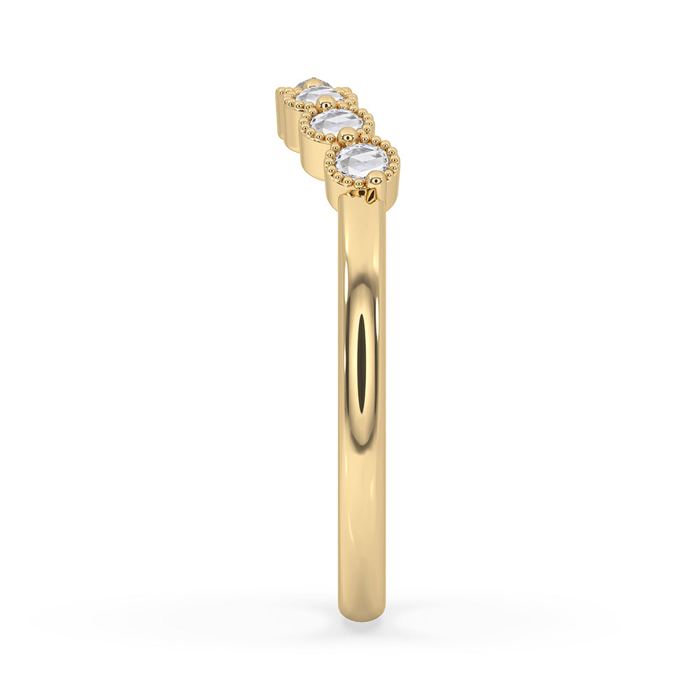 Round rose cut band paired with bezel milgrain wedding band in yellow gold band design.
