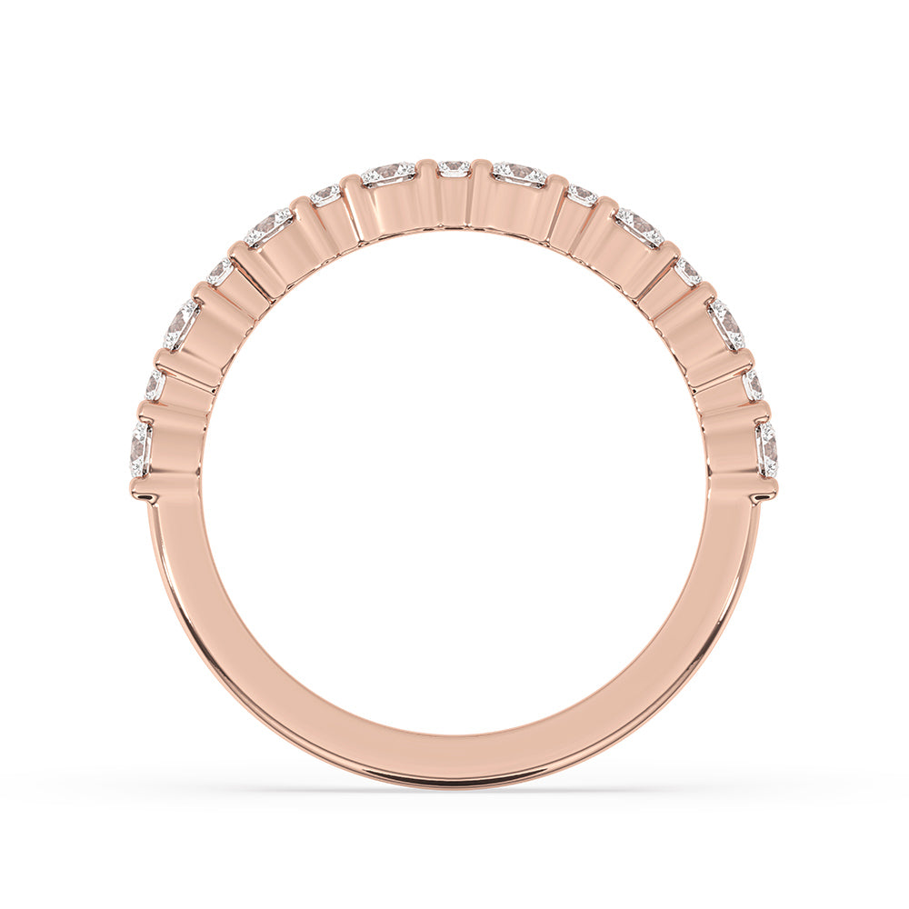 Carat Diamonds wedding band with handmade craftsmanship and prong set diamonds.
