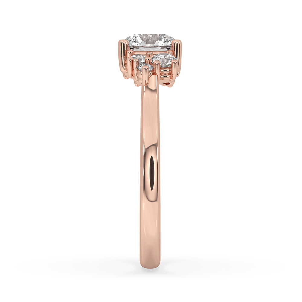 Rose gold ring with a cluster setting and round cut diamonds.
