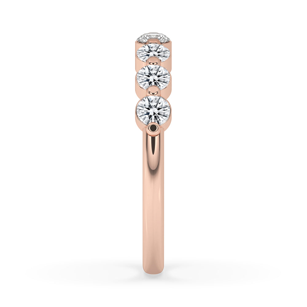 Half eternity band crafted as a Shared Prong Eternity Band in custom wedding band style.
