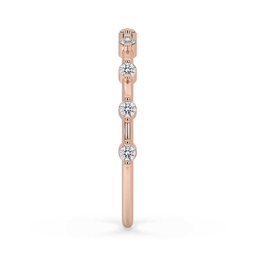 Simple wedding band crafted with Lab Grown Diamond and rose gold finish.
