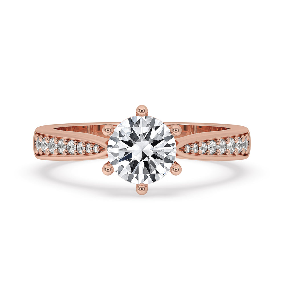 Six prong engagement ring with 2 carat round diamond, featuring cathedral setting and Lab Grown Diamond for a timeless look.
