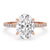 Oval hidden halo engagement ring with claw prong setting, featuring a Lab Grown Diamond in a handmade jewelry piece.
