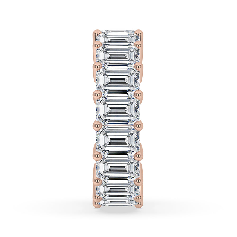Elegant emerald eternity band crafted for timeless beauty.
