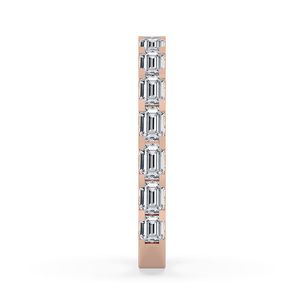 Rose gold band with elegant emerald cut diamonds
