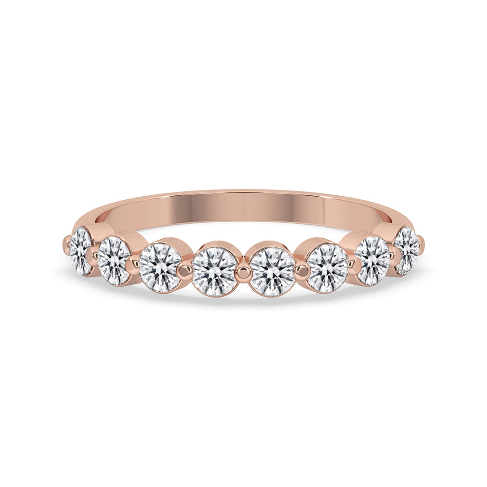 Shared Prong Eternity Band designed with round cut diamond band and rose gold band.
