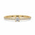 Minimalist engagement ring with a round cut diamond center stone, set in yellow gold.
