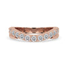Curved wedding band in rose gold with round cut diamonds.
