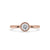 Bezel set round diamond ring displayed on a soft velvet pad.