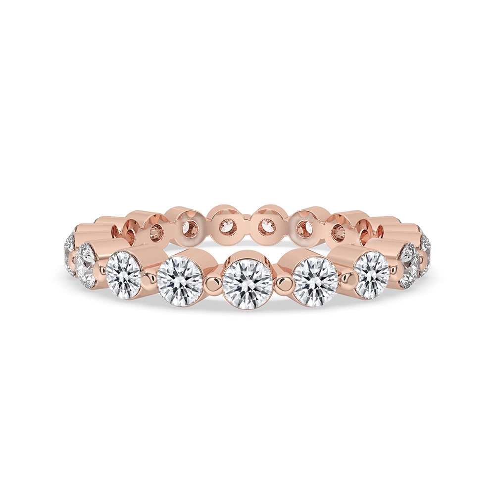 Rose Gold Eternity Band with round cut diamonds in shared prong setting.
