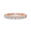 Rose Gold Eternity Band with round cut diamonds in shared prong setting.
