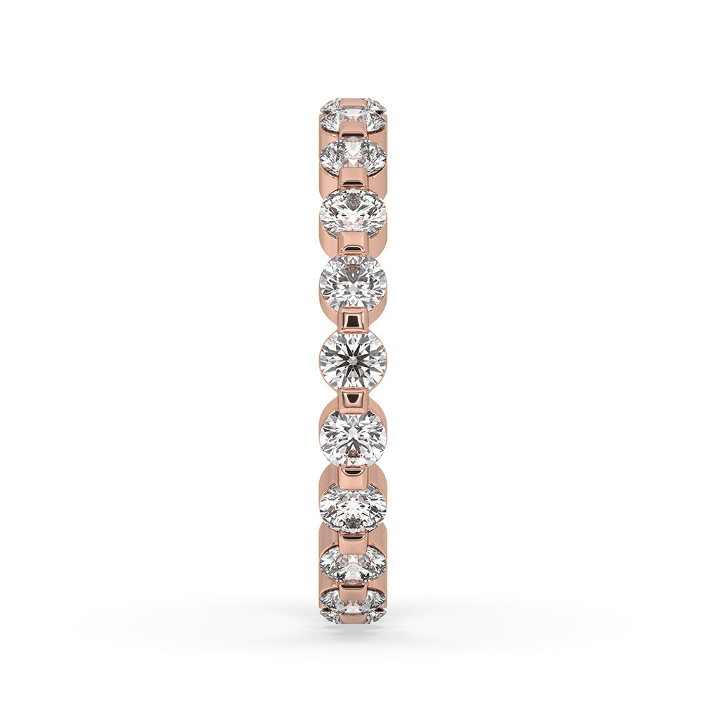 Elegant eternity diamond band handcrafted in rose gold with lab grown stones.
