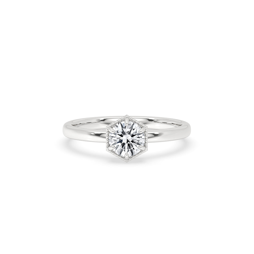 Round cut diamond engagement ring placed in a velvet box.