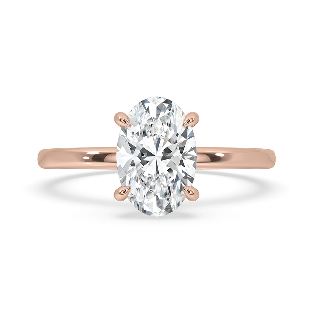 Round diamond engagement ring set in rose gold ring.

