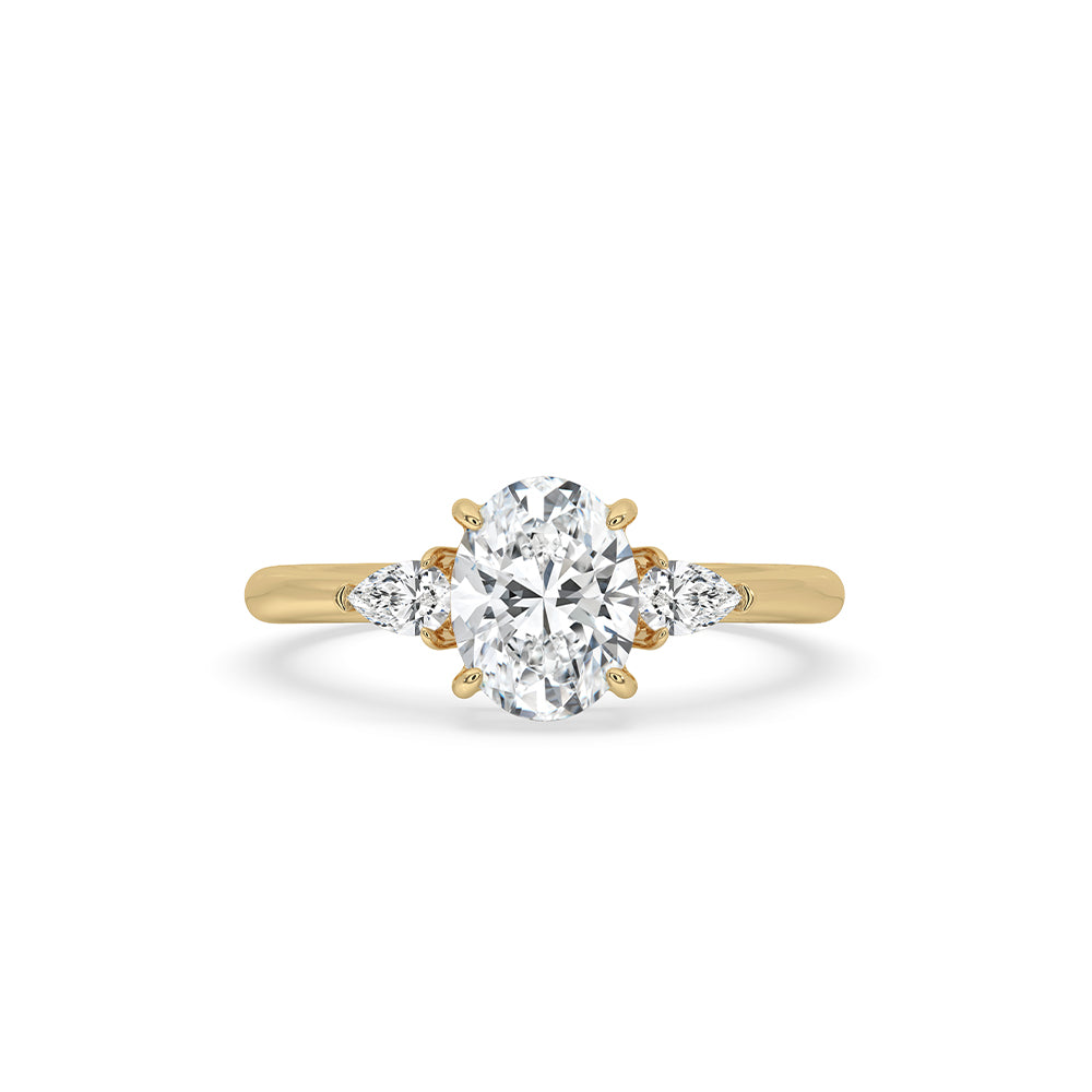 3 stone oval engagement ring with pear side stones.
