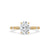 Oval diamond engagement ring displayed on a soft fabric.