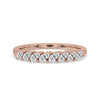Marquise Cut Wedding Band styled in half eternity band with rose gold band finish.
